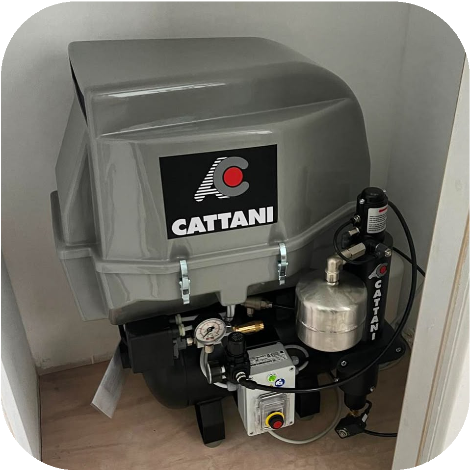Cattani ESAM air compressor installed in a riser cupboard.