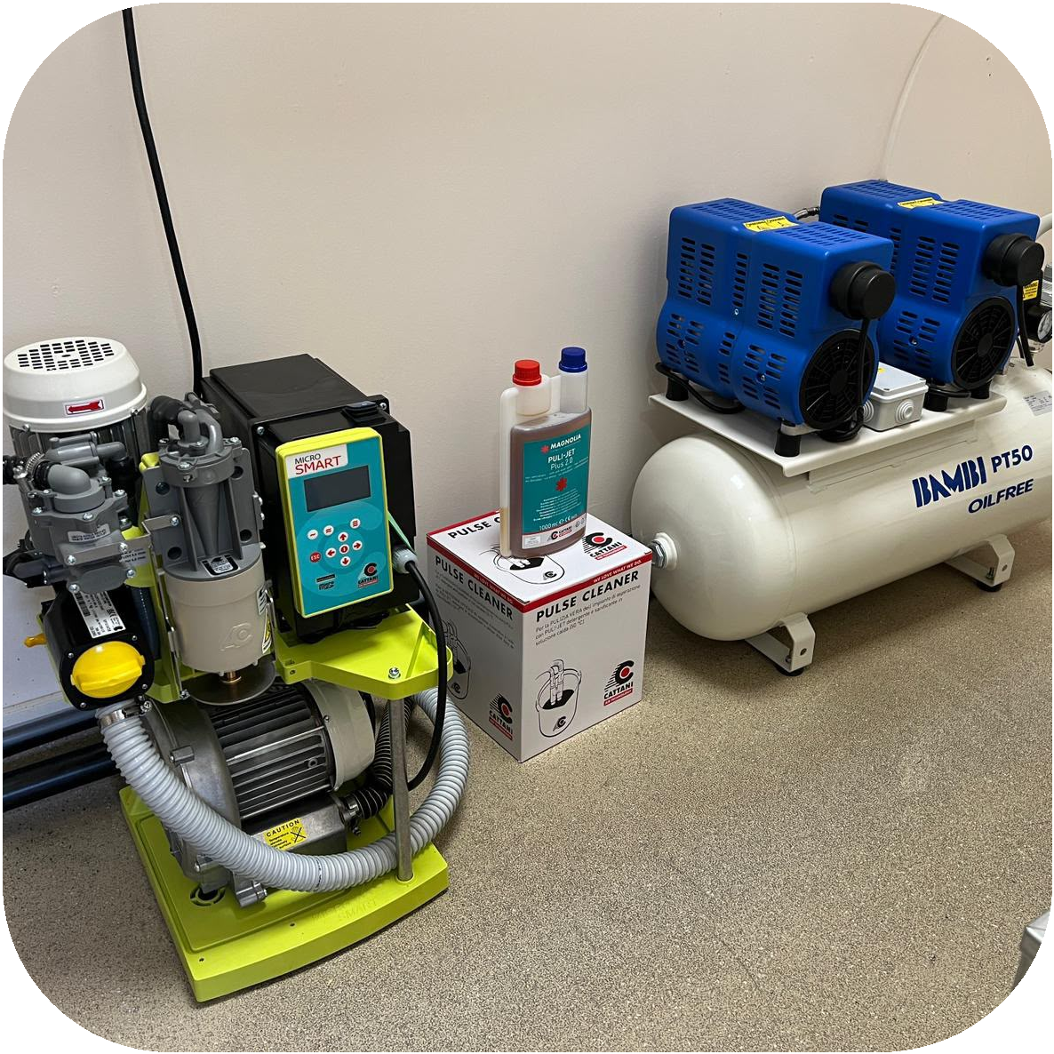 Dental suction pump and air compressor installed in a machine room.