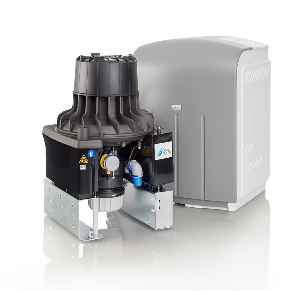 Dental suction pump by Durr dental pictured infront of a silencer box.